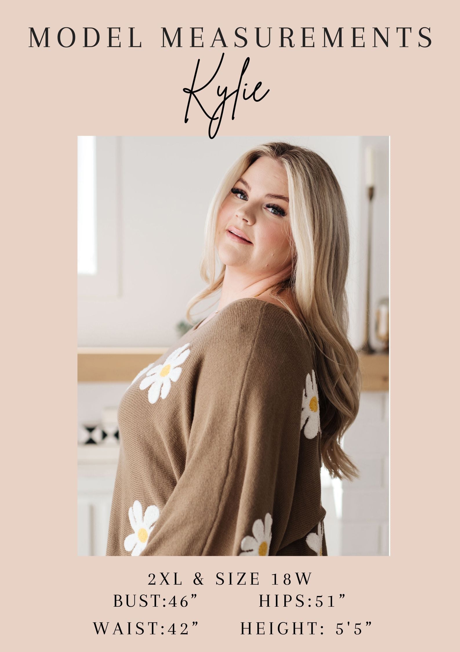 Woman wearing a brown cardigan with floral patterns, standing in a kitchen.