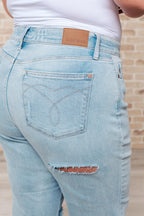 Light blue jeans with a brand label on a blurred background